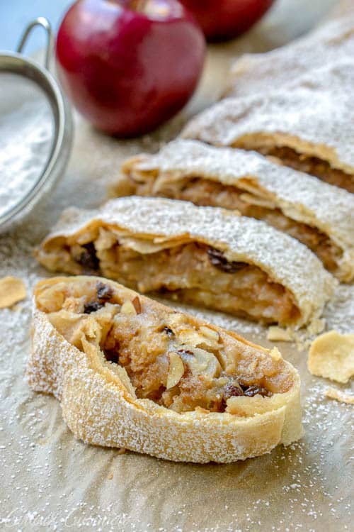 Wiener Apfelstrudel is a classic Viennese apple dessert that you probably know by the name of Apple Strudel. Flaky layers of strudel dough encase a bright fall apple filling that is studded with raisins and almonds. If you love apple pie, apple strudel is sure to be a winning recipe! 