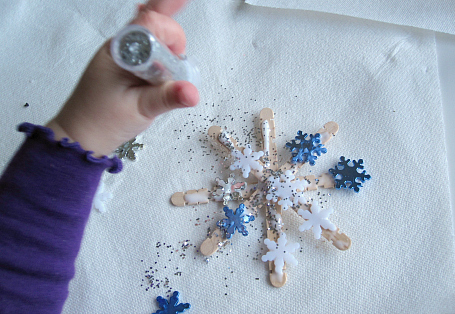 glitter and confetti popscicle stick snowflake christmas ornaments